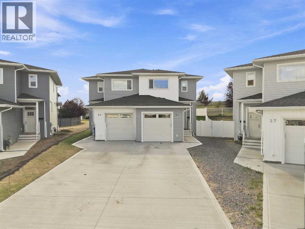 Welcome to 41 Pinnacle Close in the desirable community of Blackfalds! The extended driveway has room for two vehicles to park out front